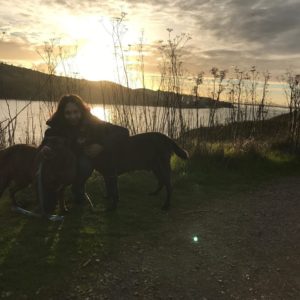 Amanda with a sunset and dog