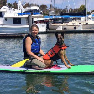 Andrea with dog on wake board